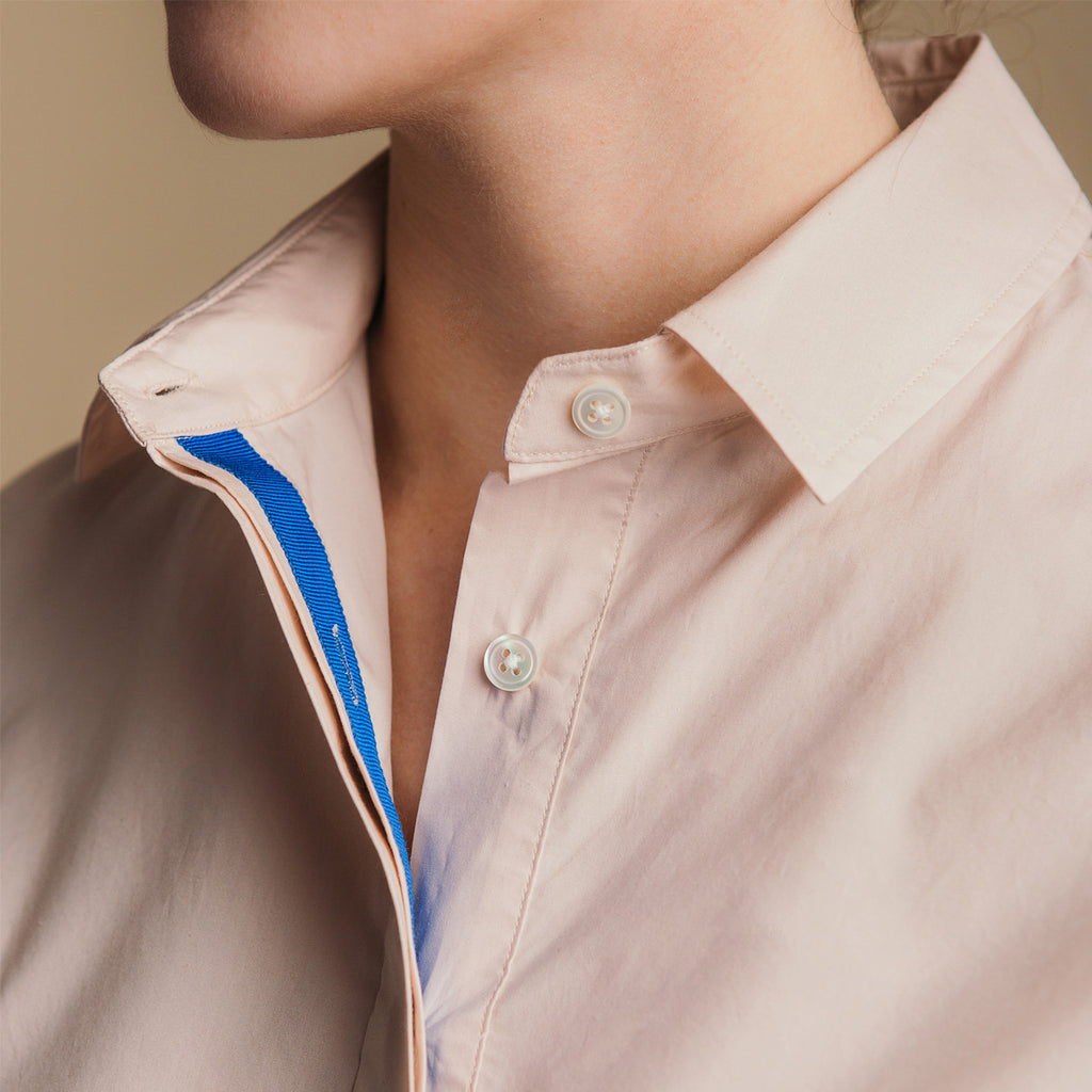 The Trapezoid Pullover - Dusty Blush. Blue grosgrain ribbon placket detail.