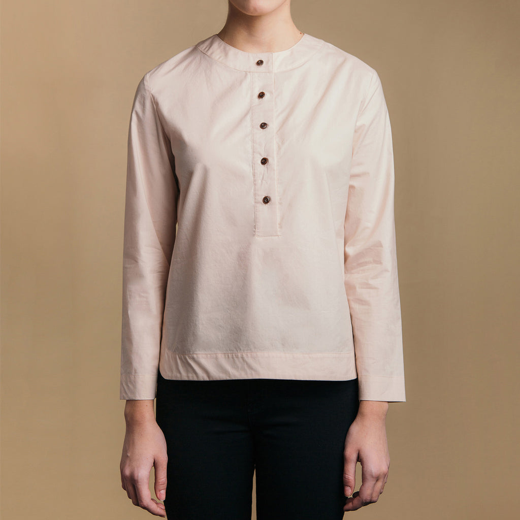 The Equilibrium Shirt - Dusty Blush, front view. Faux horn buttons. Round neck collar.