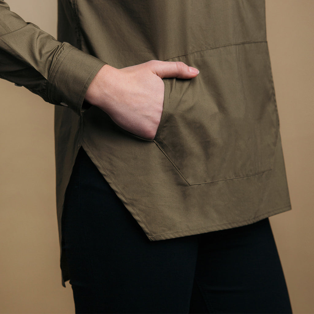 The Trapezoid Pullover - Matte Olive. Side view detail. Straight angled hem.