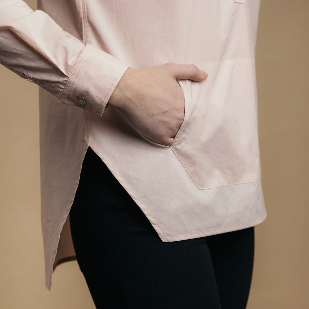 The Trapezoid Pullover - Dusty Blush. Side view detail. Straight angled hem.