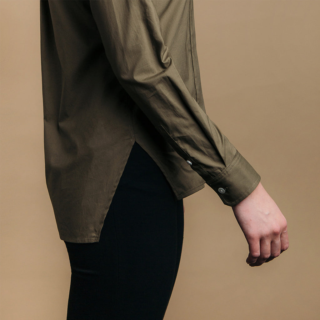 The Trapezoid Shirt - Matte Olive. Side view, angled hem meets at point.