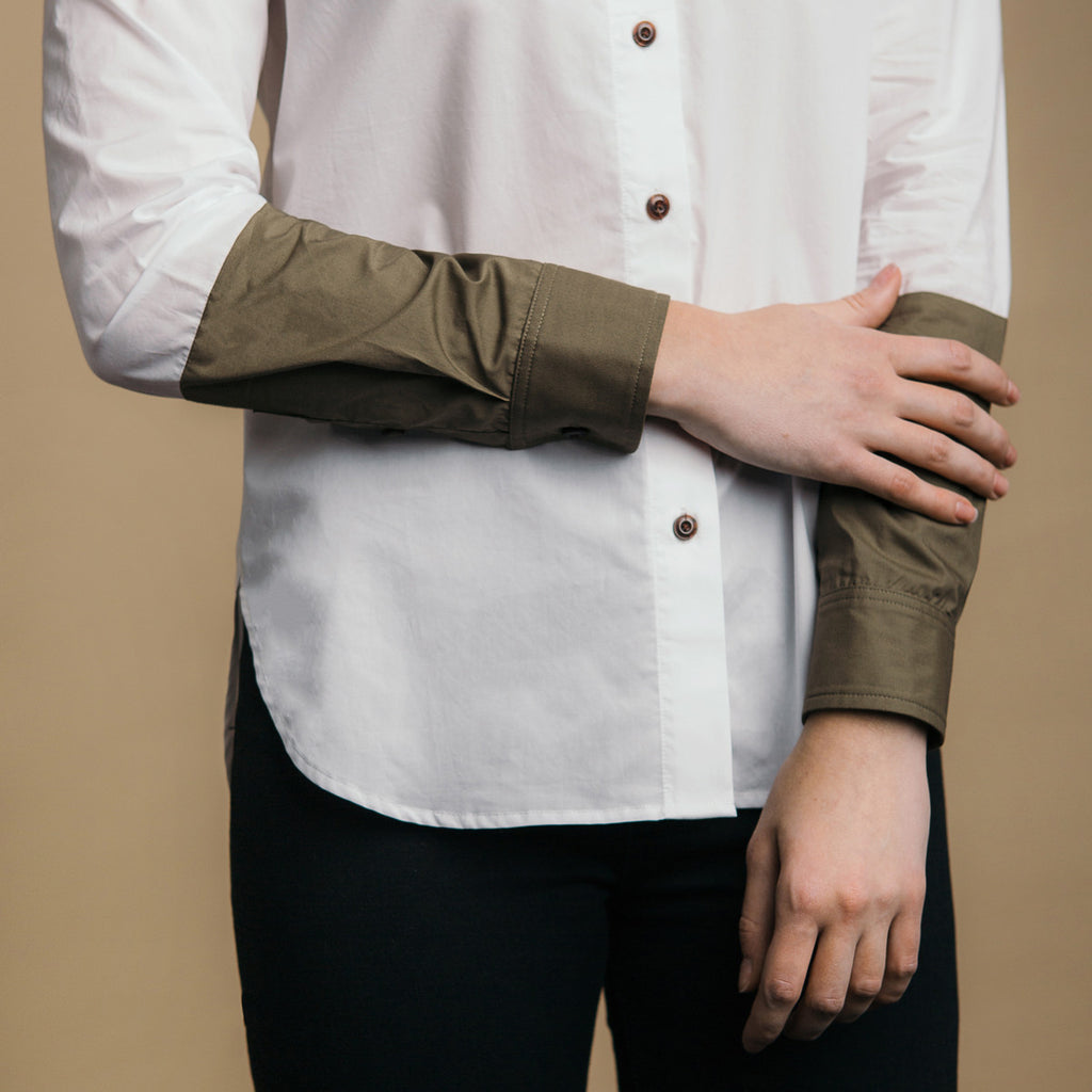 The Hand-Dipped Shirt - Paper White/Matte Olive. Color block arm detail.